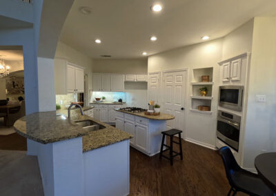 cabinet painting kitchen white cabinets granite countertops island wide view