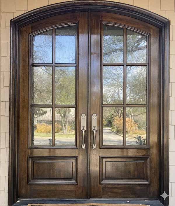 Door Staining – Double Arched Front Door | PPP North Dallas Stained dark walnut double arched front door with glass panels on North Dallas home