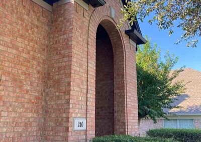 exterior painting brick home arched entry dark painted fascia gutters trim detail