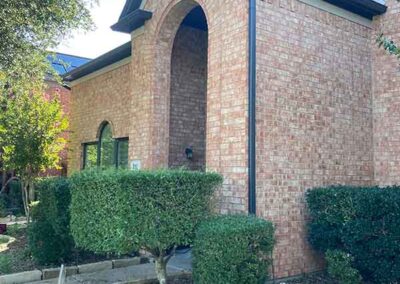 exterior painting brick home front elevation painted roofline fascia gutters arched entry