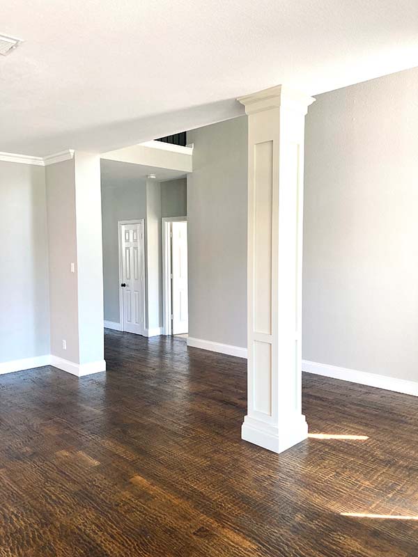 Interior painted gray walls with white decorative column and white trim in North Dallas home