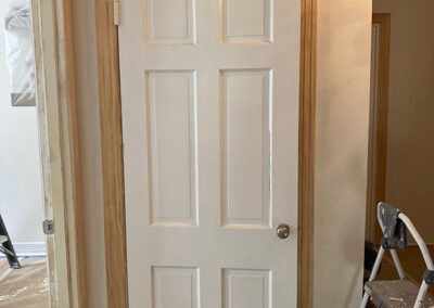 trim painting interior door casing bare wood trim installed close up prep stage